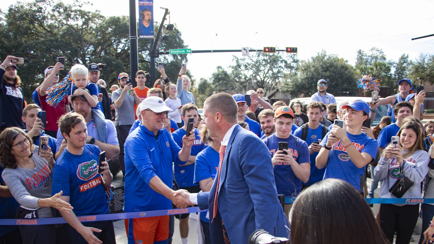 Florida Football Coach Billy Napier arrives with his family at Ben Hill Griffin Stadium for his first day on the job on Sunday, Dec. 5, 2021. Napier has hired more than 37 staffers in just over a month as Florida head coach.