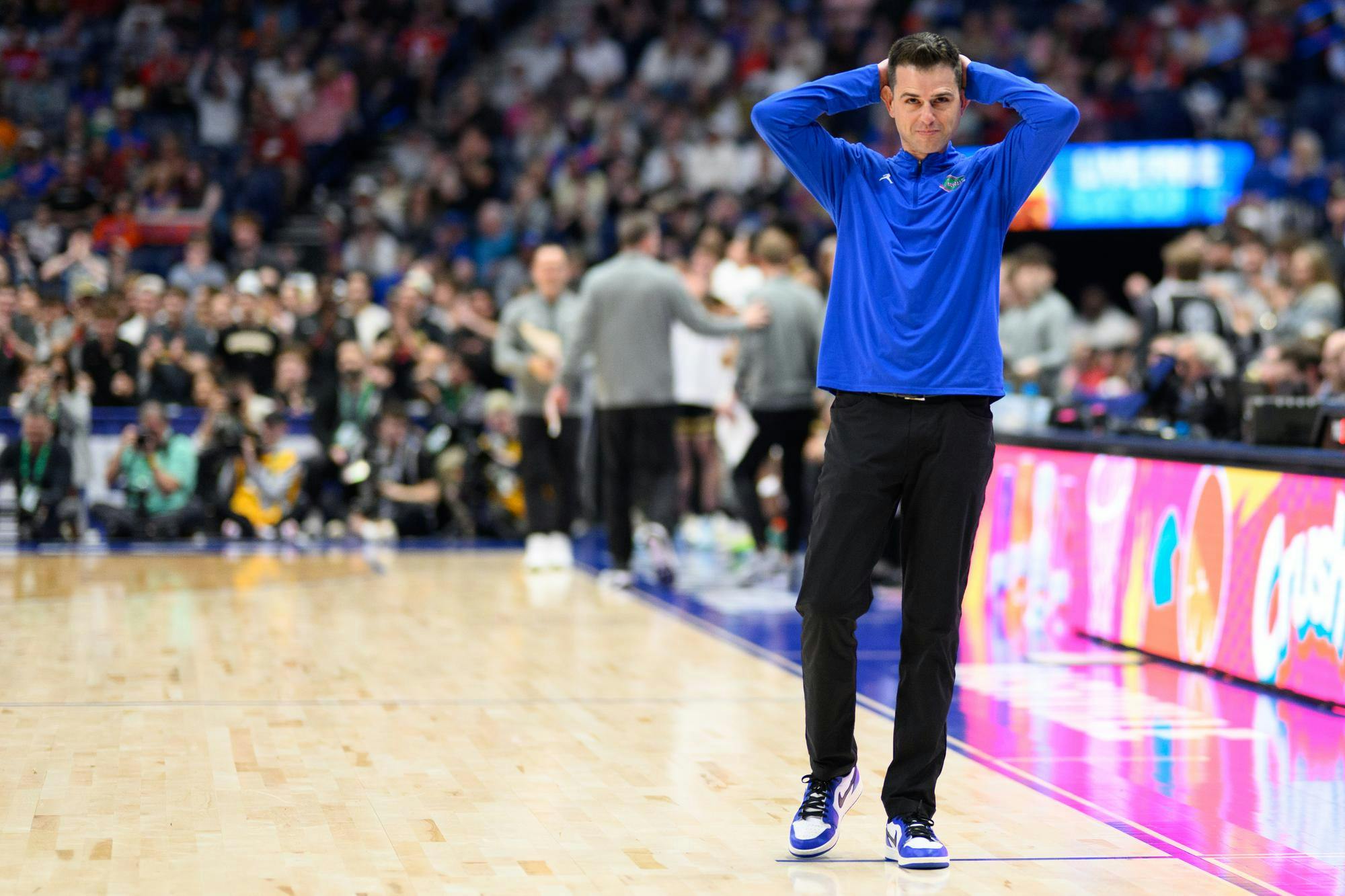 Florida head coach Todd Golden puts his hands on his head during the second half of an SEC Men's Basketball Tournament semifinal game against Vanderbilt, Saturday, March 14, 2026, in Nashville, Tenn.