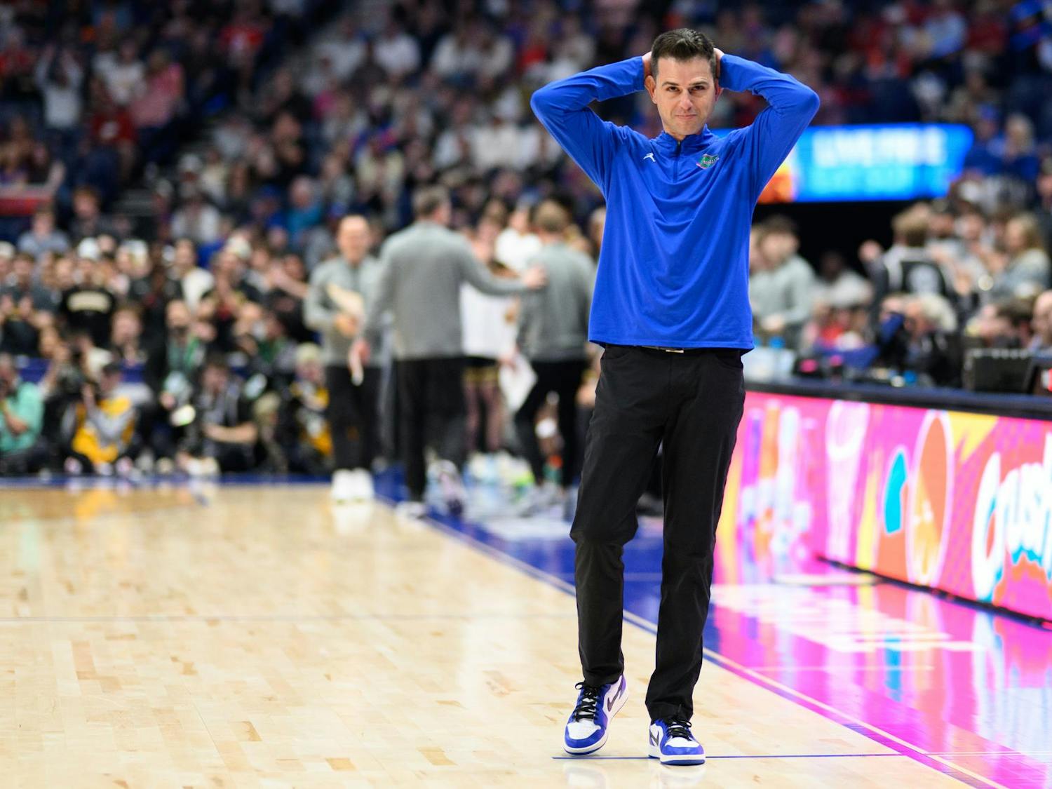 Florida head coach Todd Golden puts his hands on his head during the second half of an SEC Men's Basketball Tournament semifinal game against Vanderbilt, Saturday, March 14, 2026, in Nashville, Tenn.