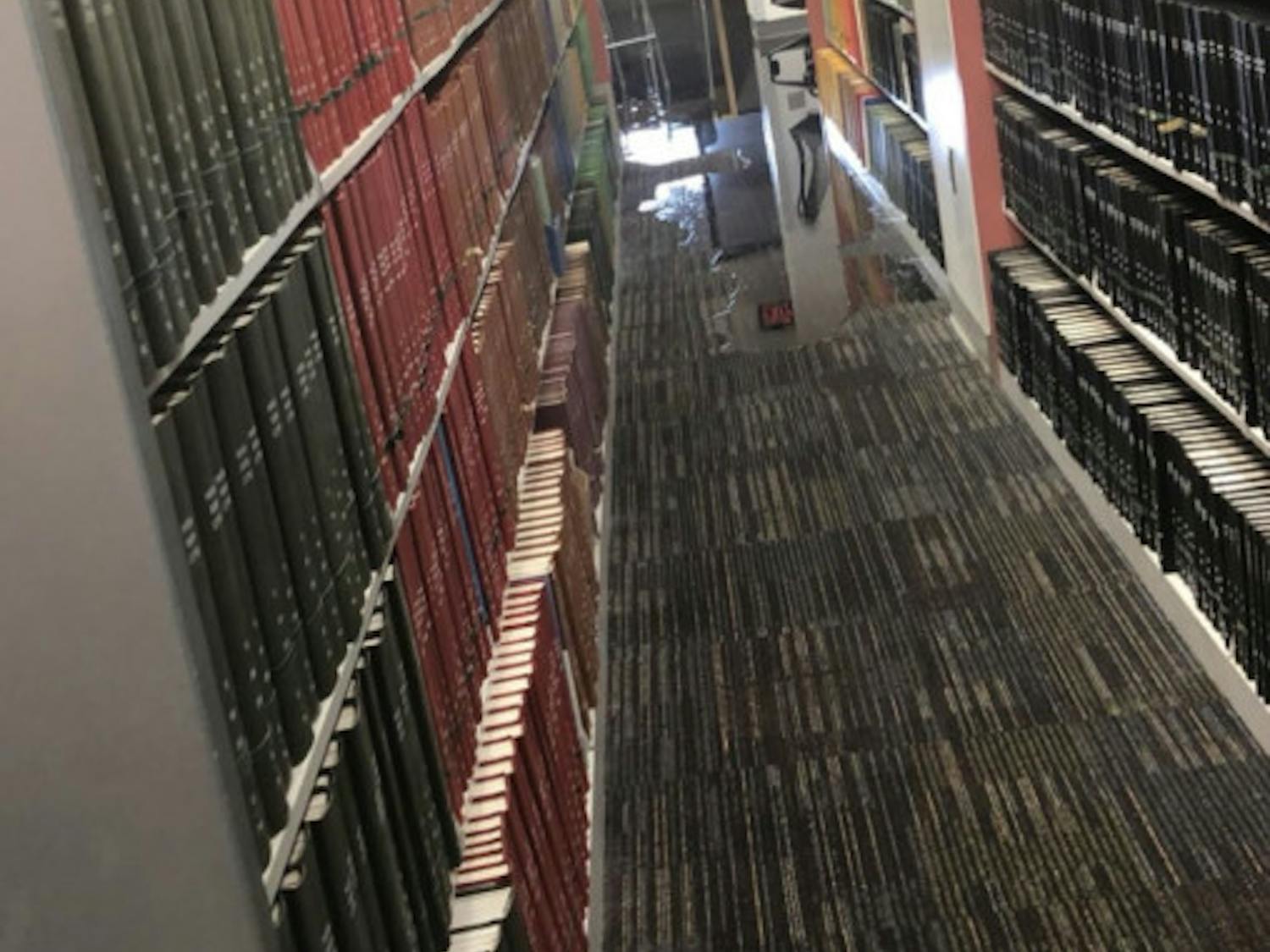 Flooding reaching the book stacks at Marston Science Library