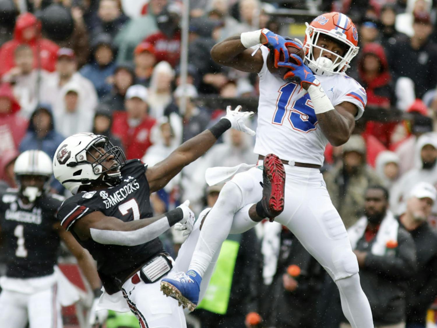 Florida's Jacob Copeland (15) catches a pass for a touchdown as South Carolina's Jammie Robinson (7) defends in the first half of an NCAA college football game Saturday, Oct. 19, 2019, in Columbia, SC.