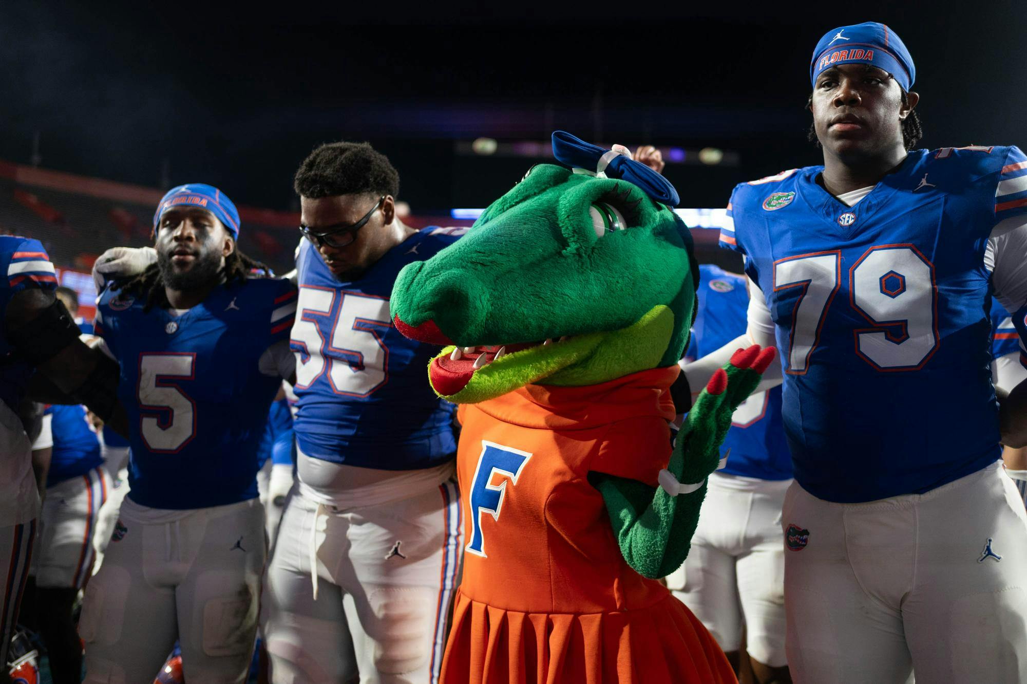 Alberta embraces Florida football players to sing Florida’s alma mater song “We Are the Boys” after an NCAA college football game against FAU, Saturday, Sept. 5, 2026, in Gainesville, Fla.