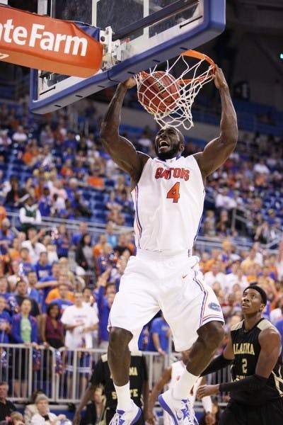 Florida center Patric Young (4) dunks the ball during an 84-35 win&nbsp; against Alabama State on Nov. 11 at the O’Connell Center. Young scored 12 points and grabbed 12 rebounds in the victory.