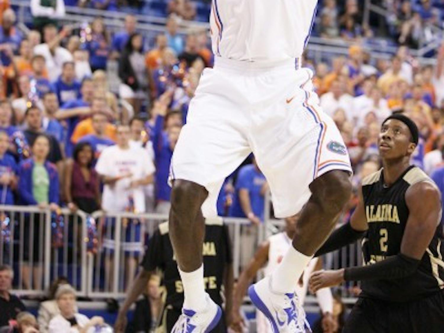 Florida center Patric Young (4) dunks the ball during an 84-35 win&nbsp; against Alabama State on Nov. 11 at the O’Connell Center. Young scored 12 points and grabbed 12 rebounds in the victory.