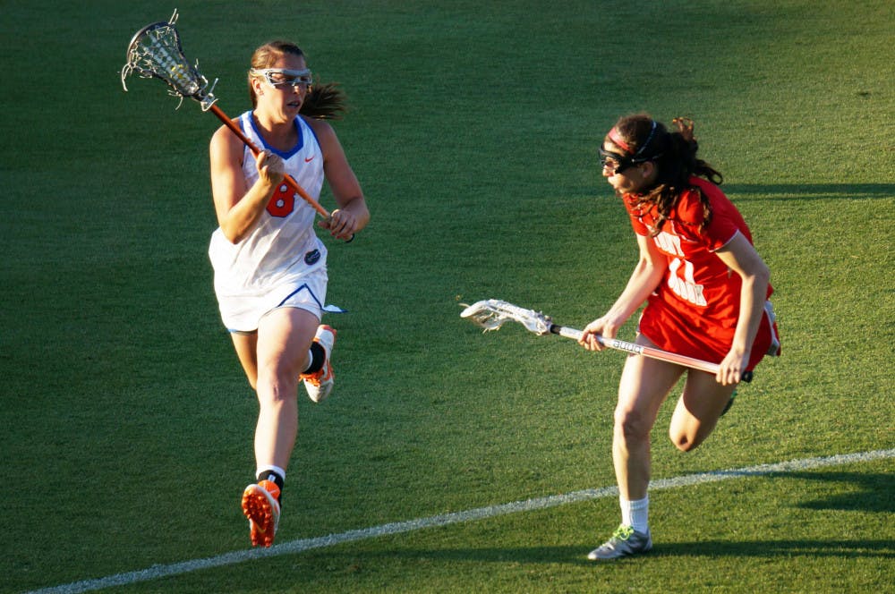 <p>Shannon Gilroy runs toward the net during Florida's 12-11 loss to Stony Brook on March 17 at Donald R. Dizney Stadium.</p>