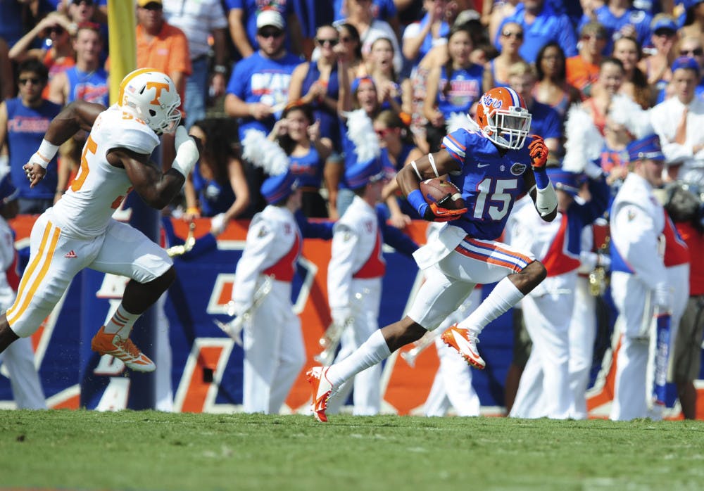 <p>Loucheiz Purifoy runs past a Tennessee defender during Florida’s 31-17 victory against Tennessee on Saturday in Ben Hill Griffin Stadium. Purifoy left Saturday's game due to a right thigh contusion.</p>