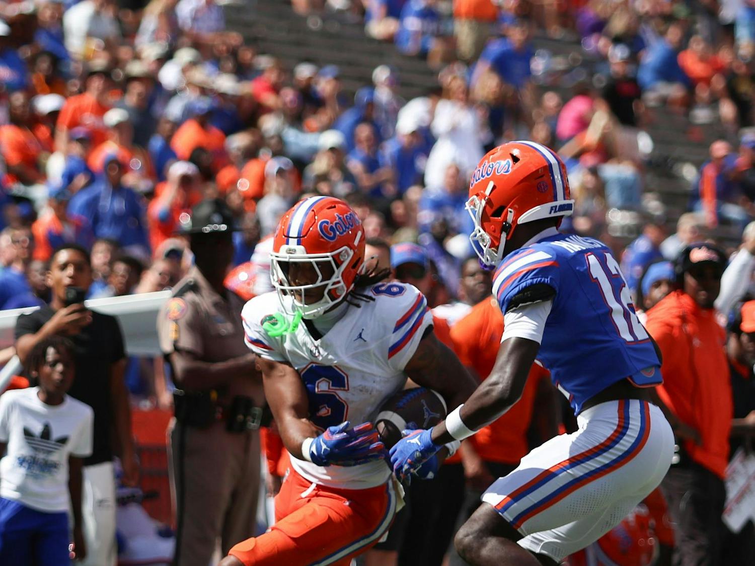 Dallas Wilson dodges a tackler during the Gators' Orange and Blue game on Saturday, April 12, 2025 at Ben Hill Griffin Stadium in Gainesville, Fla. / UAA Communications