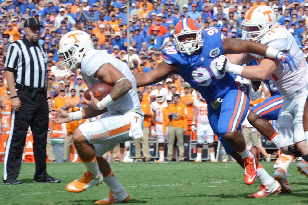 <p>UF defensive lineman Jon Bullard (90) goes for a tackle during Florida's 28-27 win against Tennessee on Sept. 26, 2015, at Ben Hill Griffin Stadium.</p>