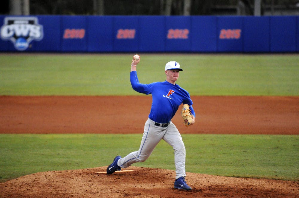 <p>UF freshman Brady Singer pitched during a Florida preseason scrimmage on Jan. 29, 2016, at McKethan Stadium.</p>