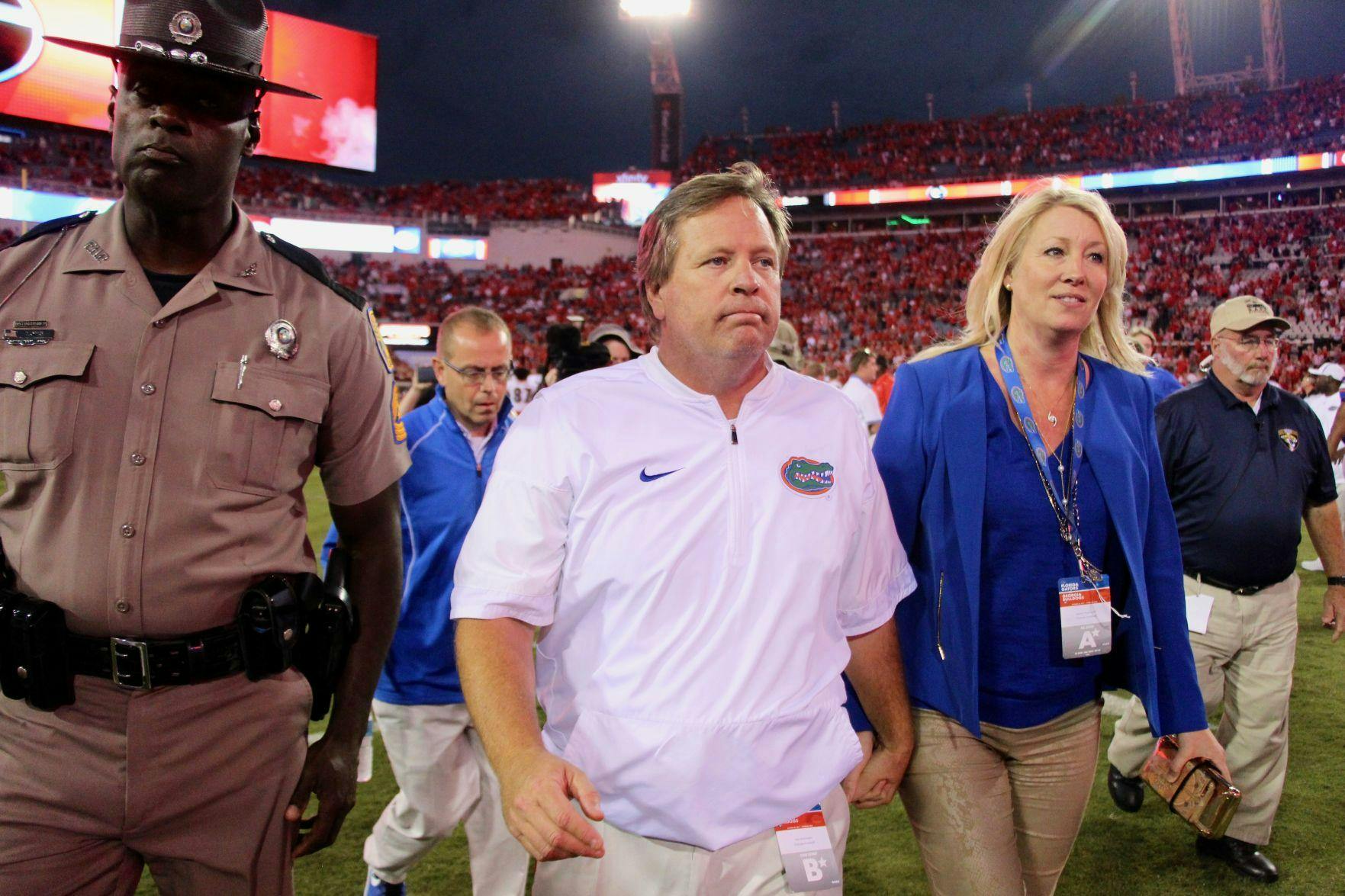 Jim McElwain walks off the field after Florida's 42-7 loss to Georgia on Saturday, Oct. 28, 2017, at EverBank Field in Jacksonville.
