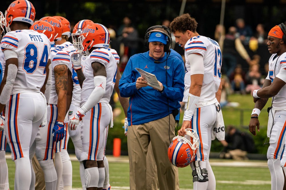 UF coach Dan Mullen and quarterback Feleipe Franks gameplan during Florida's comeback win over Vanderbilt, 37-27. Franks passed for a career-high 284 yards along with two touchdowns despite two turnovers. 