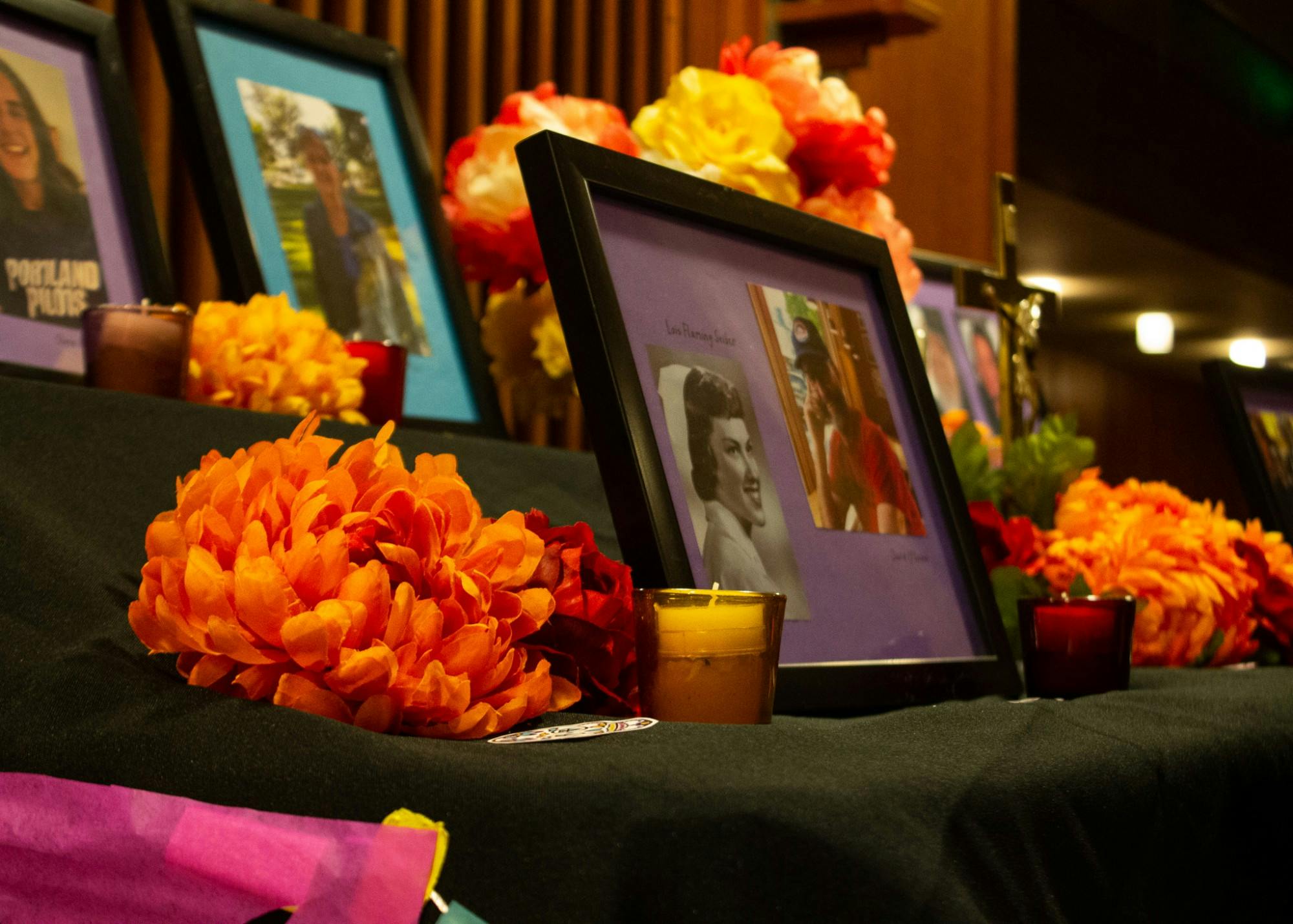 A colorful alter filled with photos of UP community member's loved ones who have passed. The ofrenda can be found in the Chapel of Christ the Teacher from October 29 through November 6.