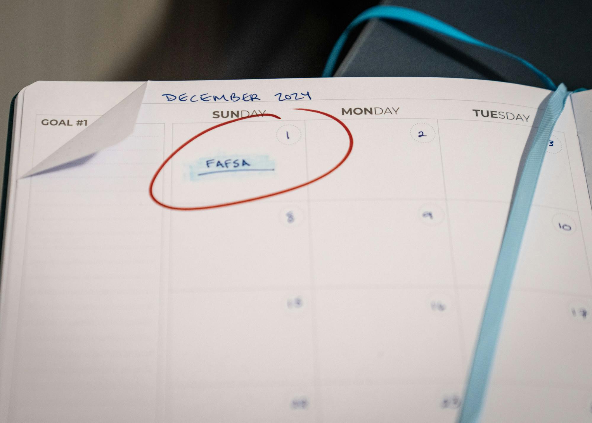 A calendar depicting Dec. 1 circled in red, with FAFSA written and underlined on that date. FAFSA is pushed back to Dec. 1, 2024 amid  persistent technical issues from last year’s troubled rollout. Photo illustration by Amanda Stern.