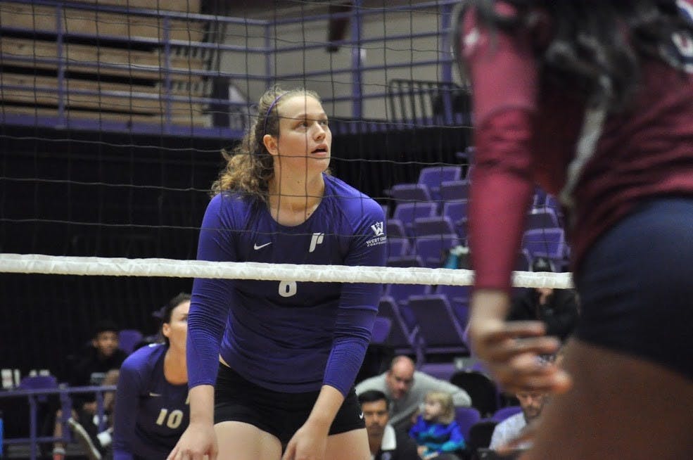  Photo by Kristen Garcia | Katie Sullivan prepares to swing at the ball. Sullivan led both teams with 16 kills.