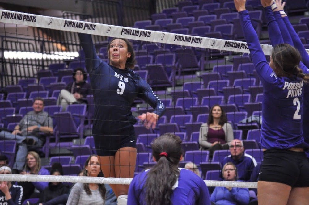  BYU's Alexa Gray goes for the tip against Pilot blockers. Gray had 30 kills in the match. | Photo by Kristen Garcia