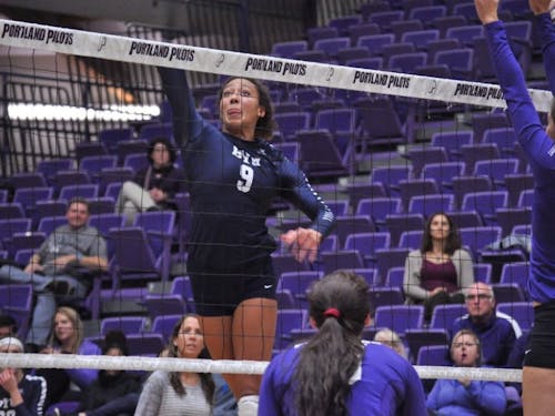  BYU's Alexa Gray goes for the tip against Pilot blockers. Gray had 30 kills in the match. | Photo by Kristen Garcia