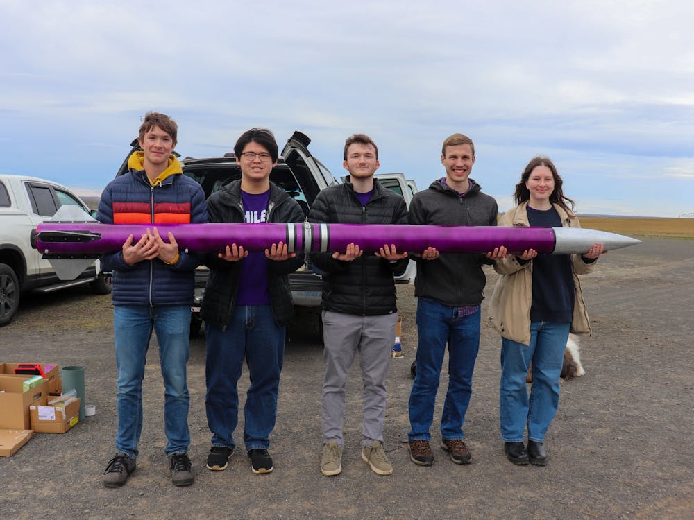 Members of LaunchUP with their full-scale rocket design on a test launch day. Photo courtesy of LaunchUP.