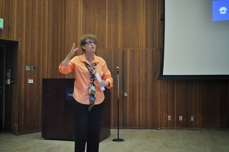  Spanish professor Kate Regan explains her film "Trekking with Quijote" before its showing in Buckley Center Auditorium. This her third full-length film. Photo by Kristin Garcia.