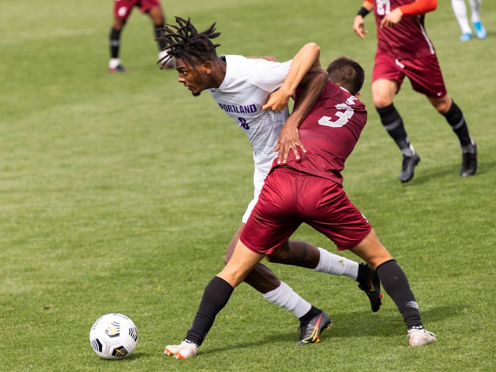 Midfielder Miles Robinson fights for the ball.