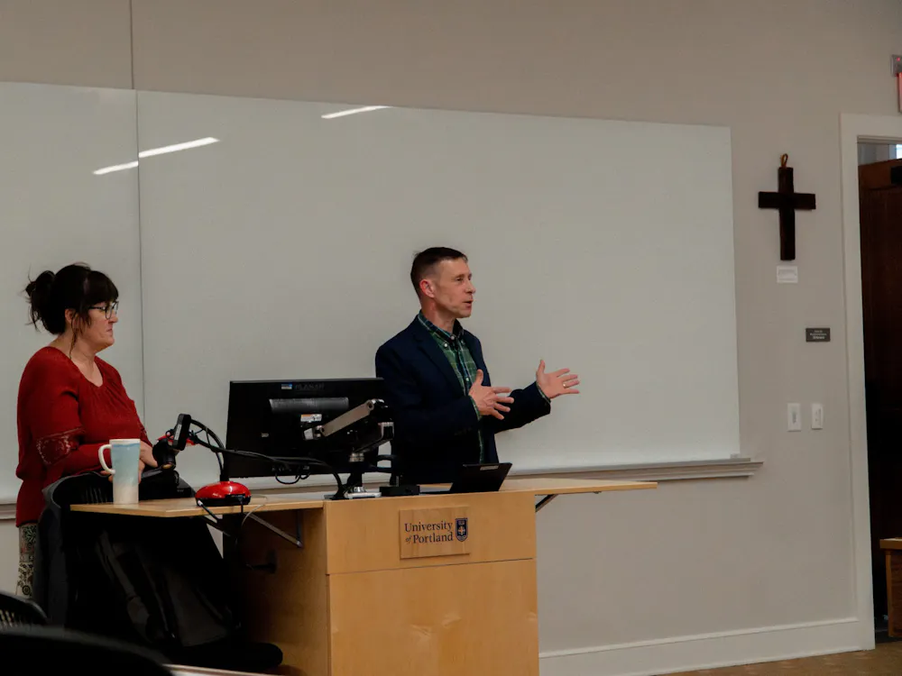 Anne Santiago (left) and John Zavage (right) answer student questions during a Q&A session to discuss "Operation Epic Fury.”