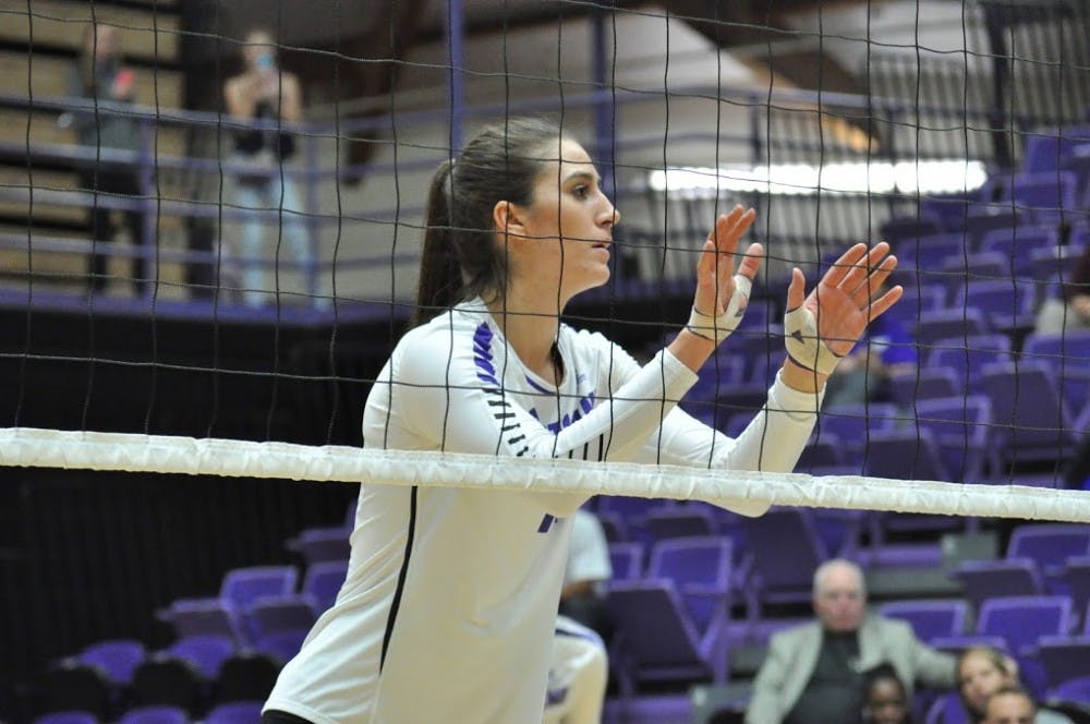  Photo by Kristen Garcia | Sophomore Sarah Savoca prepares for Portland to serve.