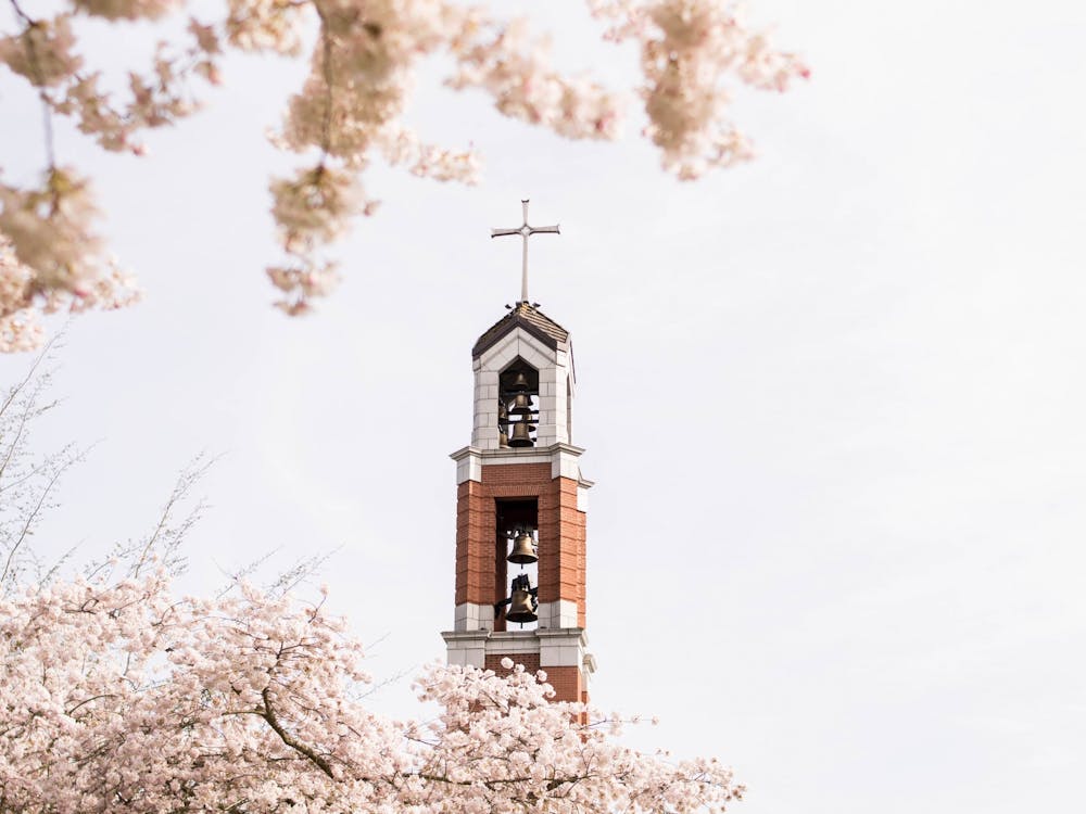 The bell tower sits among the cherry blossoms, signifying that Easter is around the corner.