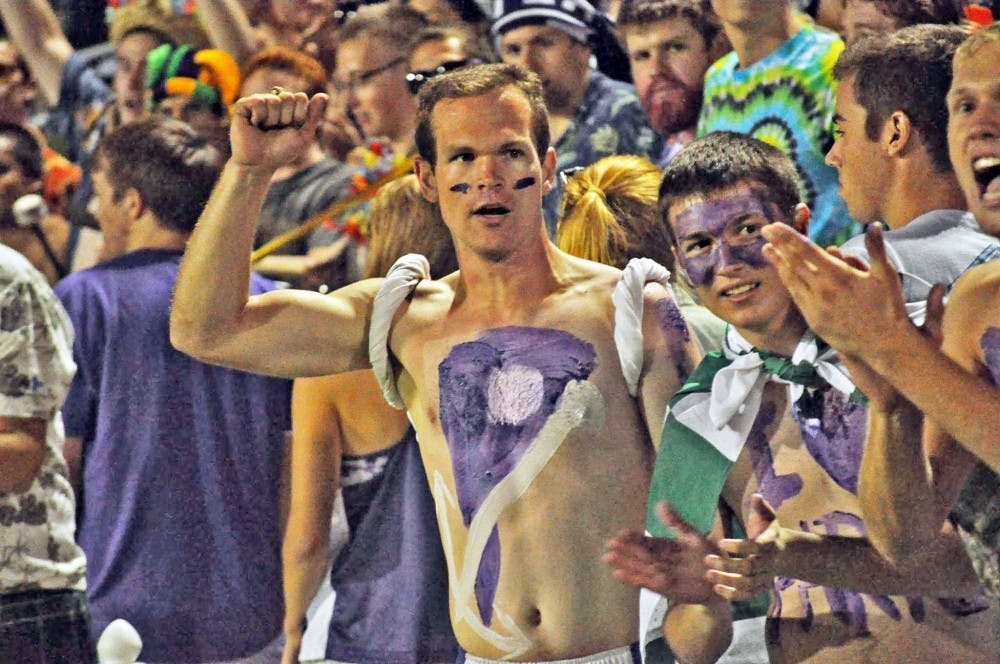  Senior Caleb Patterson cheers on the women's soccer team.Photo by Kristen Garcia.