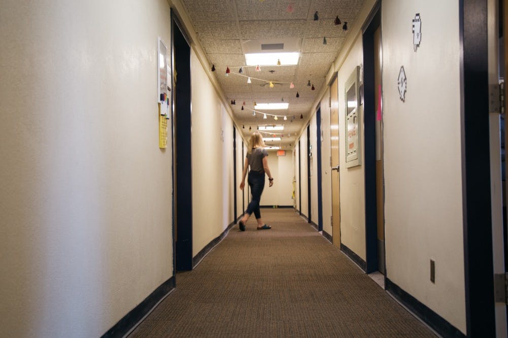 An RA roams the dorm hallways for her hourly night duty rounds in Corrado Hall.&nbsp;