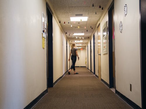 An RA roams the dorm hallways for her hourly night duty rounds in Corrado Hall.&nbsp;