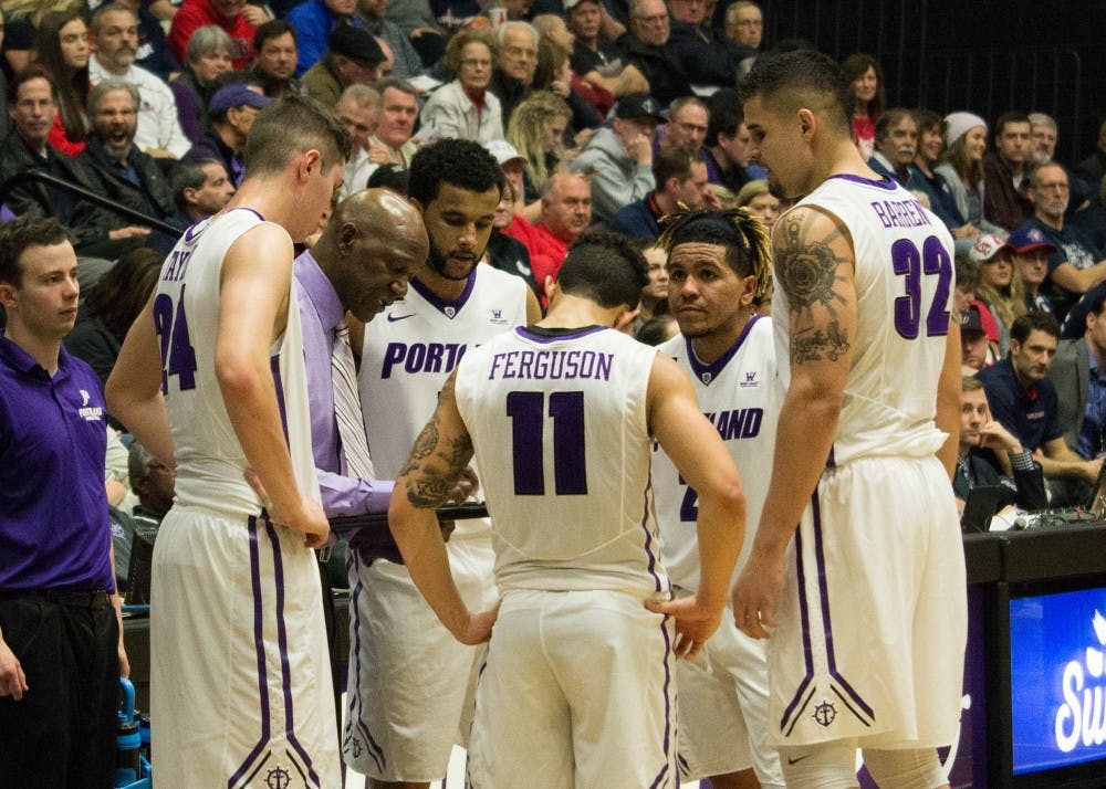 First-year head coach Terry Porter draws up a play for the Pilots during a time-out.&nbsp;