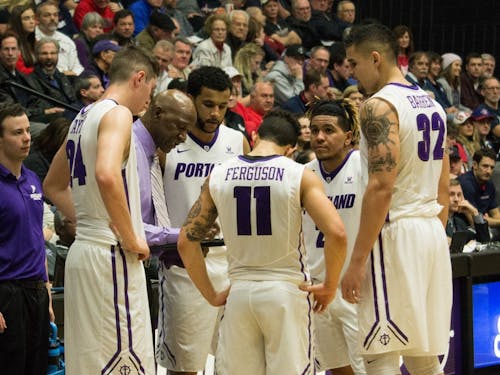 First-year head coach Terry Porter draws up a play for the Pilots during a time-out.&nbsp;