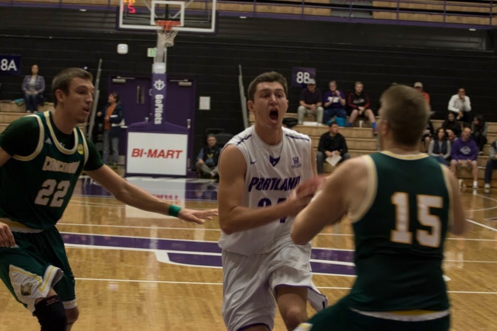  Gabe Taylor takes the ball to the hoop. Taylor had a game-high 17 points in Saturday night's game in the Chiles Center. | Photo by Kristen Garcia