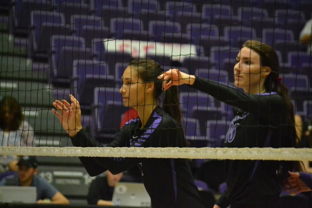 Photo by Thomas Dempsey |Emily Liger (right) and Brittney Markwith (left) prepare for Portland to serve in Friday's match against St. Francis.
