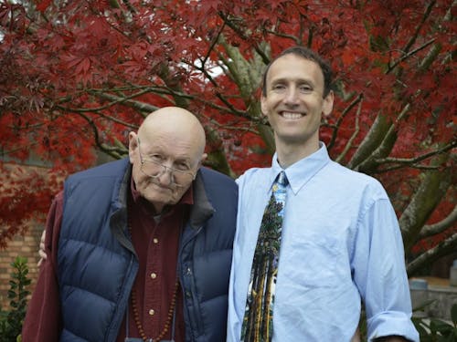  Michael Taylor stands with his son, biology professor David Taylor: Michael is a frequent visitor to campus, spending time befriending students, reading the newspaper or solving mathematical proofs.Photo by W.C. Lawson