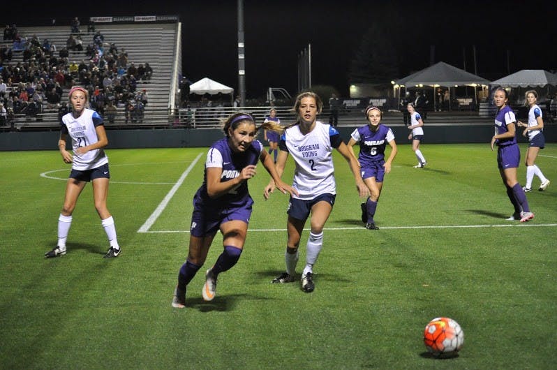  Photo by Kristen Garcia | Maddie Dieker races a BYU player for the ball. Dieker currently has one goal on the season.