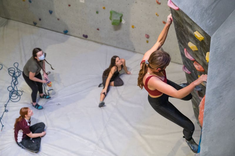 Climbers giving beta (climbing tips) for a bouldering route