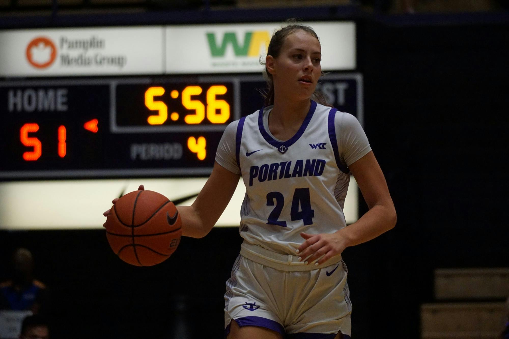 Freshman guard Maisie Burnham dribbling the ball up the court. Burnham finished with 8 points and 4 rebounds against Santa Clara.