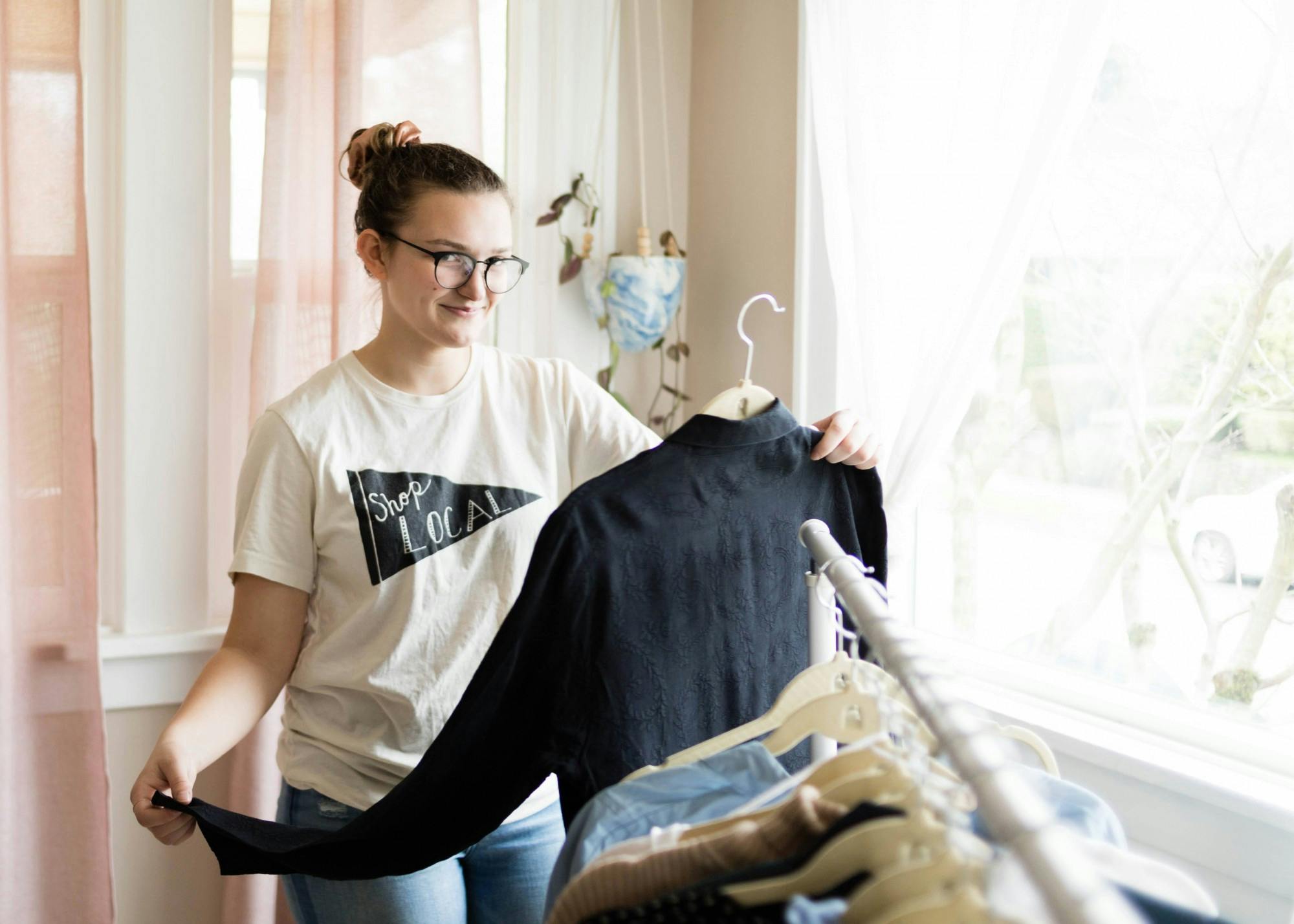 Senior Courtney Warta puts a spin on green fashion by selling second-hand clothing on Poshmark.