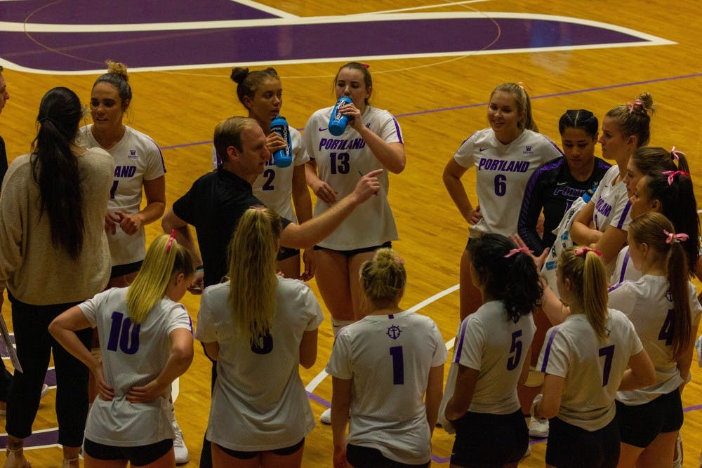 The team recuperates during a time out.