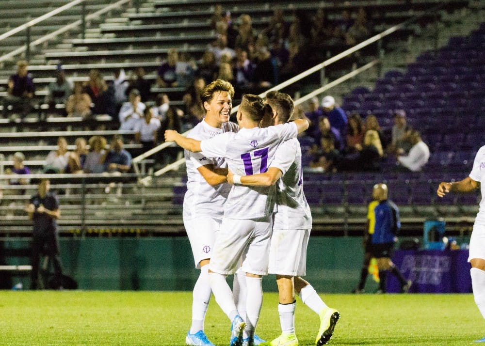 A few players celebrate after a goal.