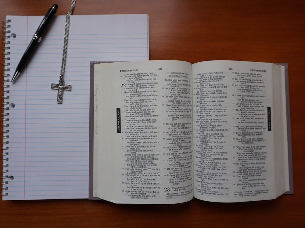 A Bible sits open ready to be read, analyzed and discussed. All UP students are invited to reflect, connect, and pray in small groups through the One Body Initiative. Photo Illustration by Marek Corsello.