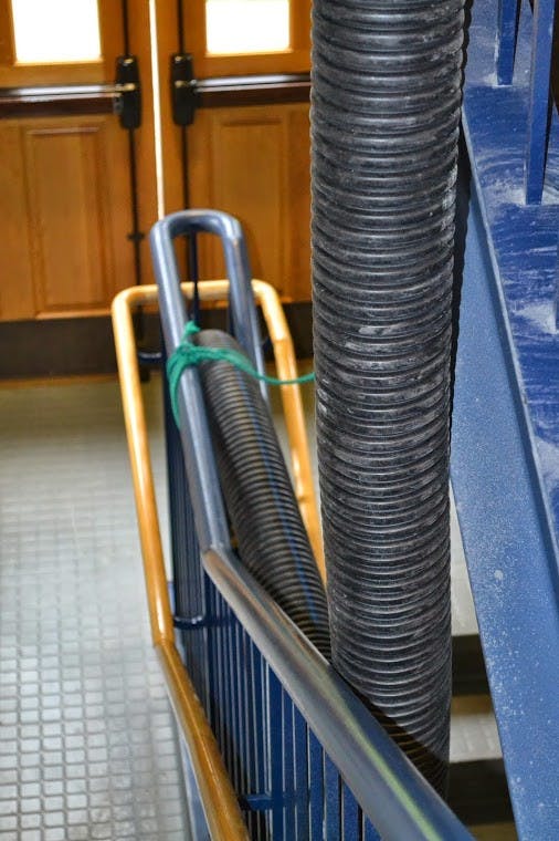  Christie Hall's putt-putt golf course is made up of tubes strung up on the stairs.Photo by David DiLoreto