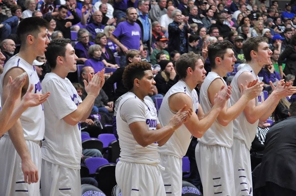  Photo by Kristen Garcia | The men's basketball bench applauds during game vs. BYU.