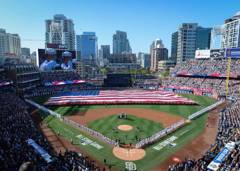 160712-N-NV908-496SAN DIEGO (July 12, 2016) Sailors man the rails while Marines hold up the American flag during the pre-game ceremony of the 2016 Major League Baseball All-Star Game at Petco Park. Sailors from the aircraft carrier USS Theodore Roosevelt (CVN 71) and Marines from the 3rd Marine Aircraft Wing joined together to participate in a salute to the United States Armed Forces. (U.S. Navy photo by Mass Communication Specialist 3rd Class Chad M. Trudeau)