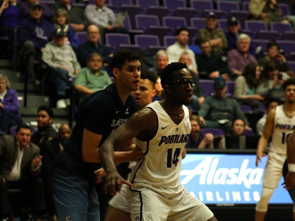 Sophomore power forward Tahirou Diabate is marked by another player.