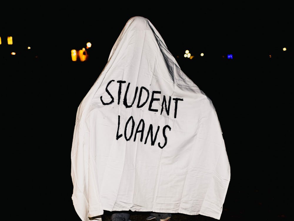 The most haunting costume of them all: Student Loans. Photo illustration by Molly Lowney. 