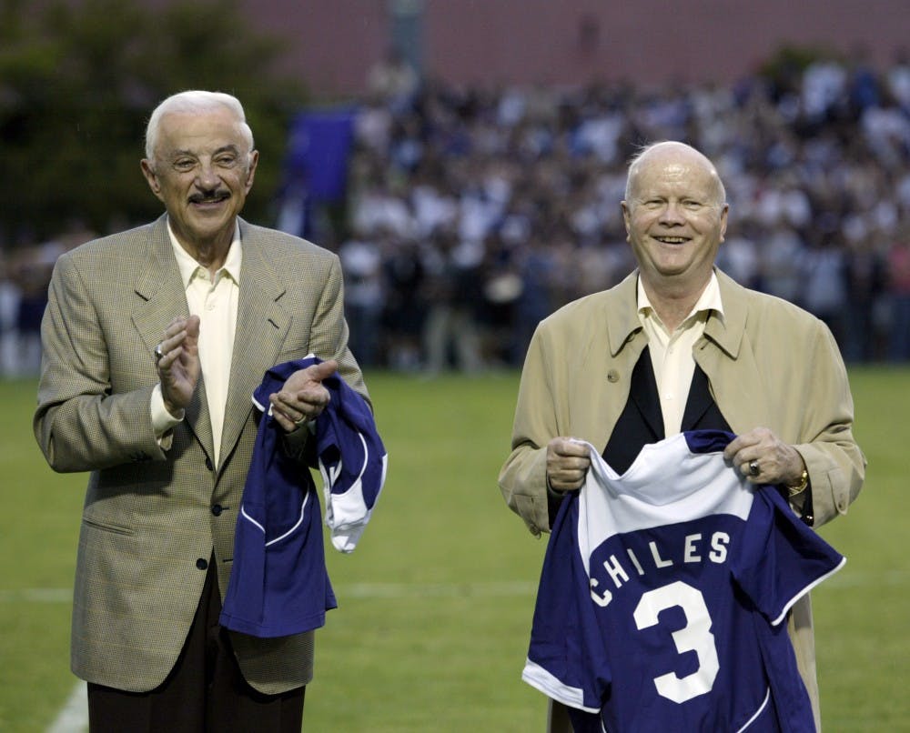 Harry Merlo (left) and Earle Chiles (right) on Merlo Field. 