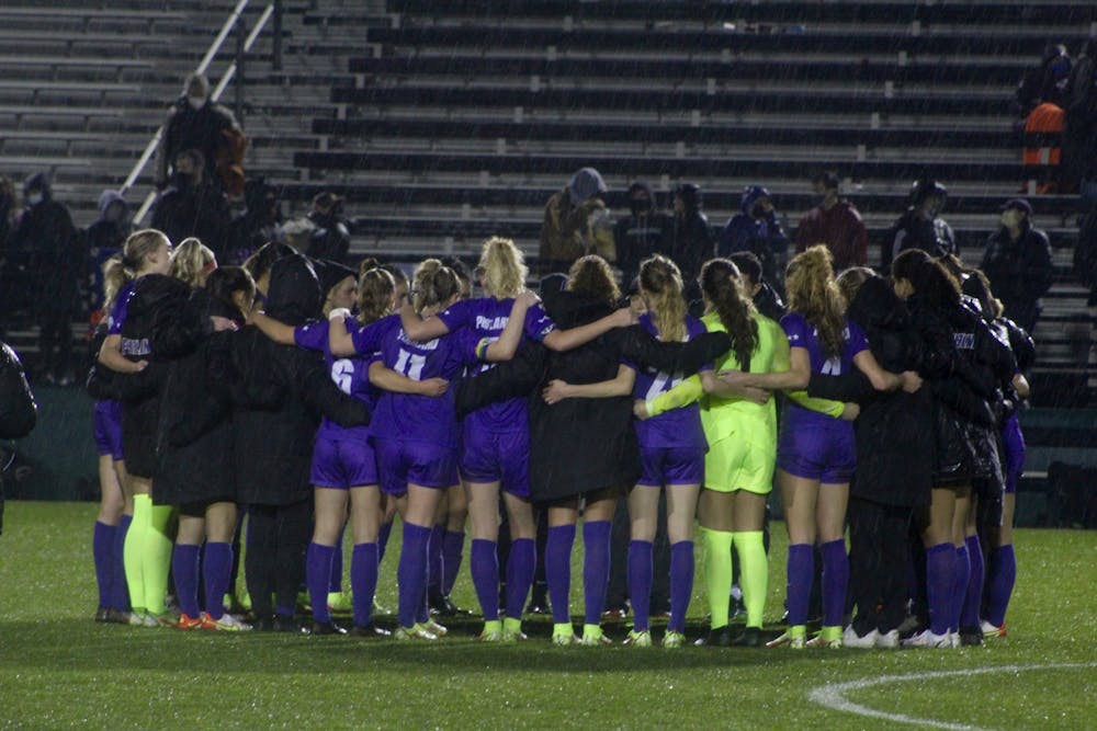 The UP women&#x27;s soccer team shares a group huddle after their last home game of the season.