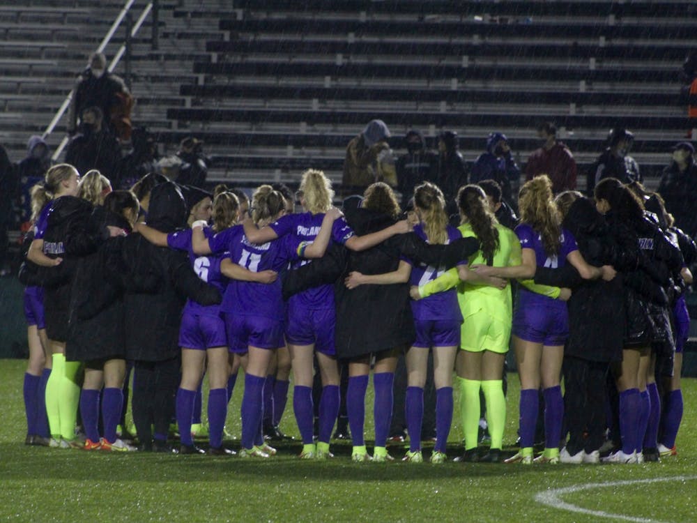 The UP women&#x27;s soccer team shares a group huddle after their last home game of the season.