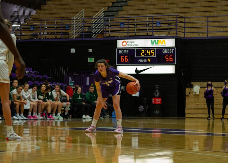 Guard Rose Pflug dribbles the ball in game against Colorado State
